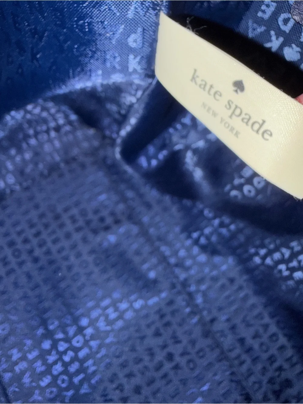 kate spade pebbled leather tote in navy with gold logo